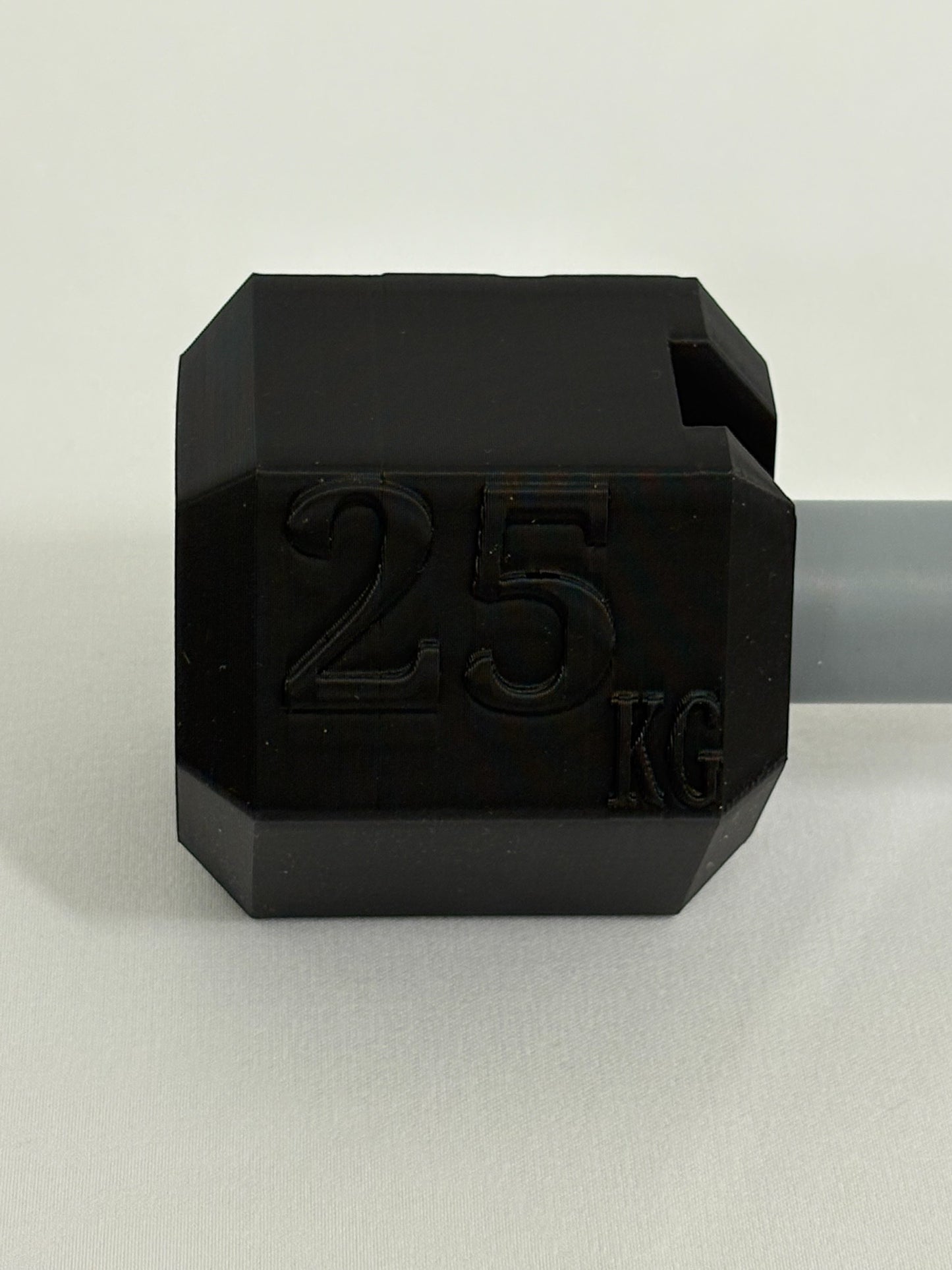 Visitkortholder designet som håndvægt